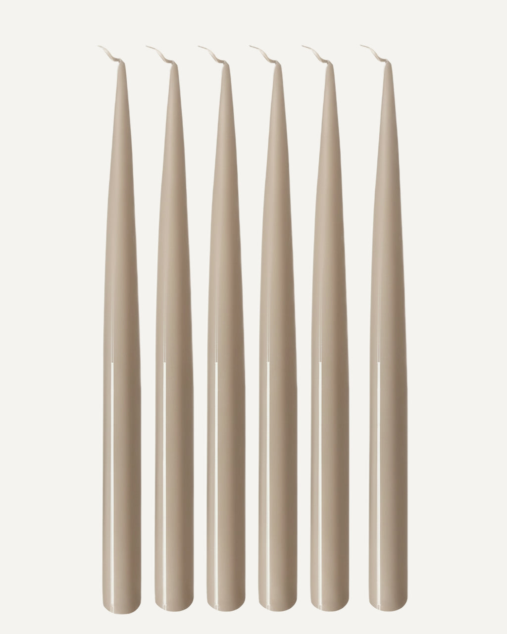 Set of six PLAMYA taper candles in Sand Ash (grey) shade on a white background