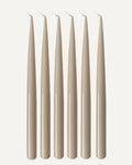 Set of six PLAMYA taper candles in Sand Ash (grey) shade on a white background