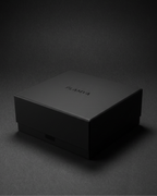 Closed black gift box for volcanic stone candles on a dark background