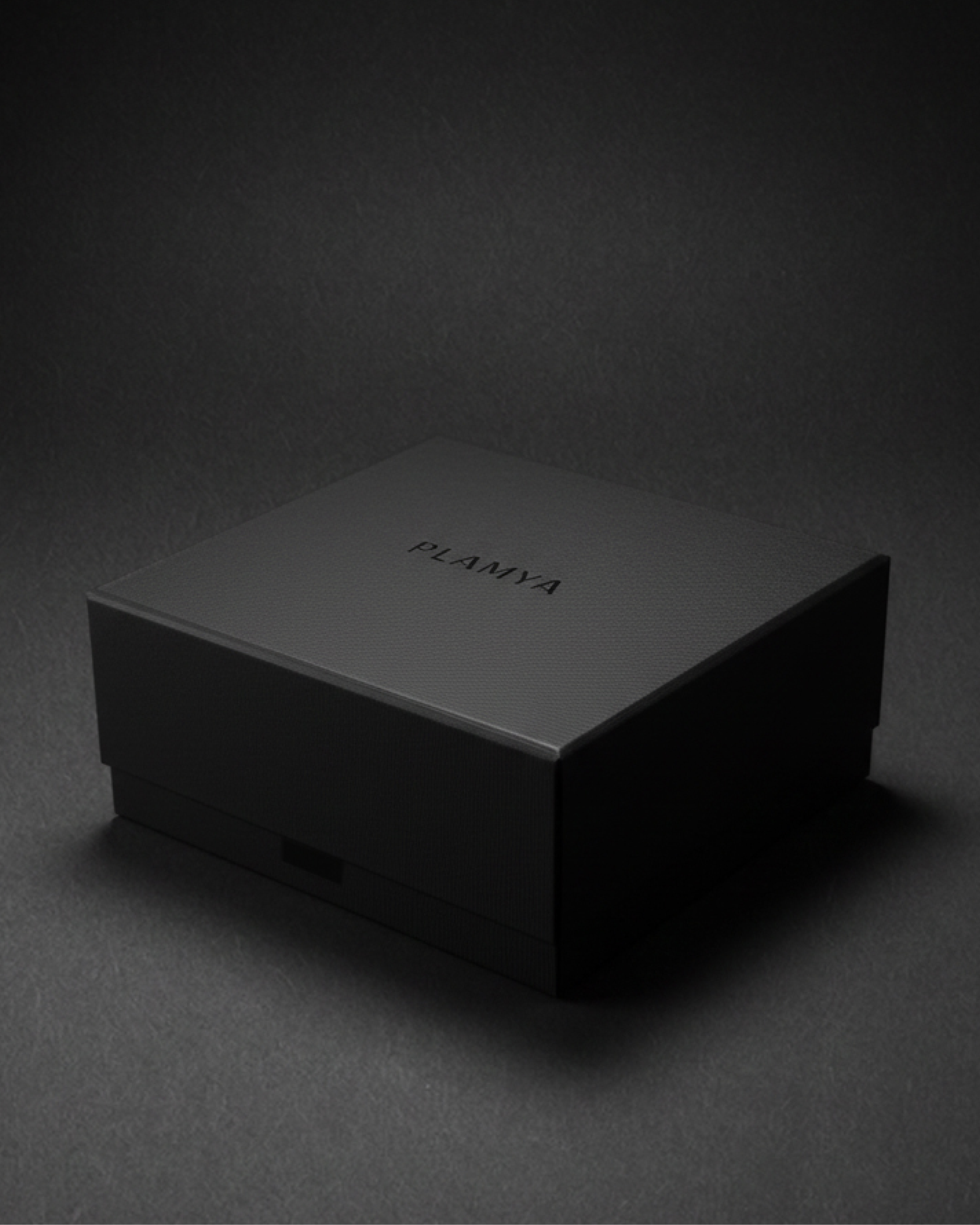 Closed black gift box for volcanic stone candles on a dark background